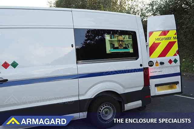 An Armagard digital advertising van-side enclosure in a utilities van