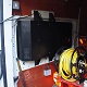 The van-side digital 32" enclosure installed in a work van